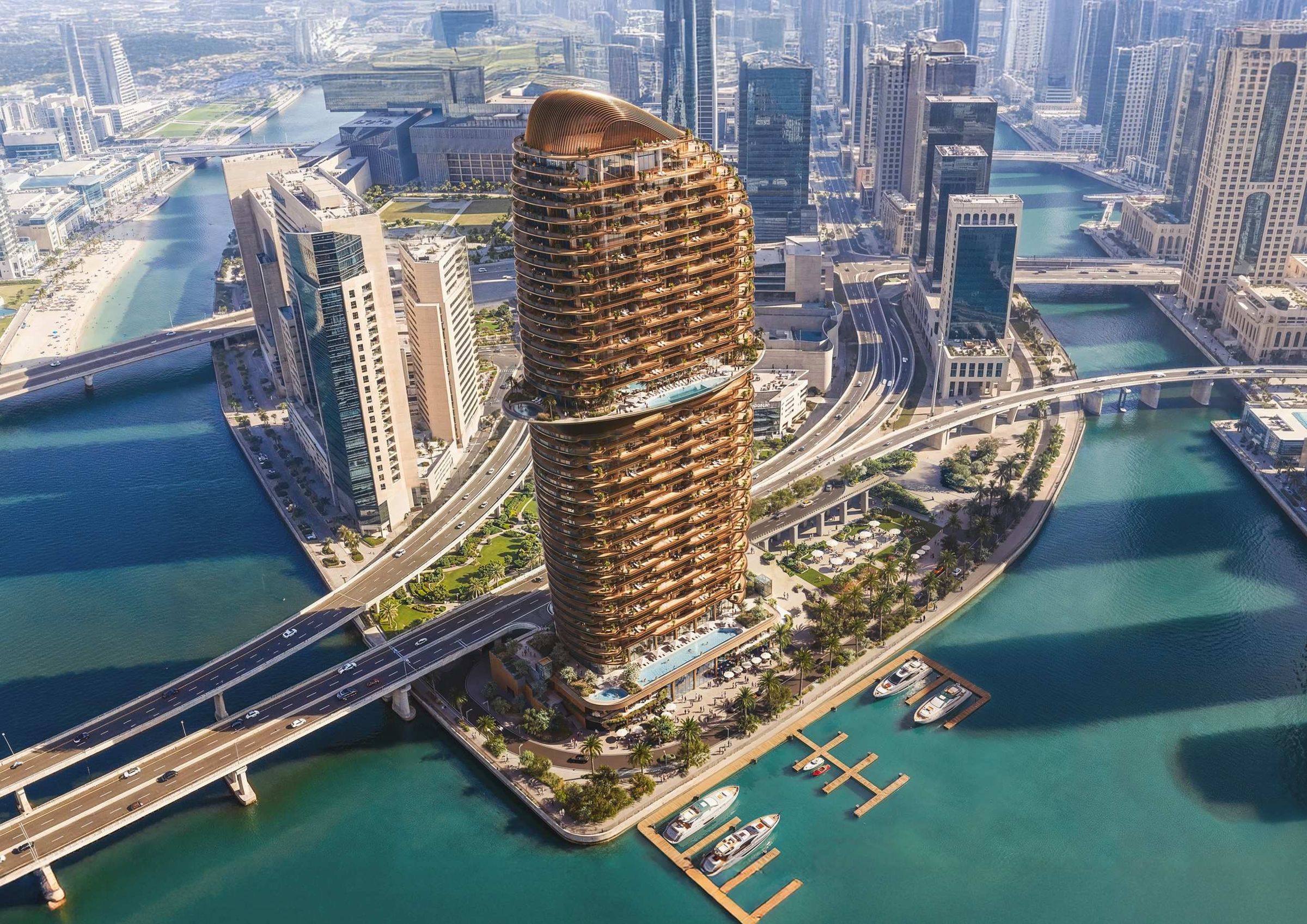 Jumeirah Residences Al Maryah Island from the air: the amber tower on the water's edge, with its marina berths and the Al Maryah skyline behind