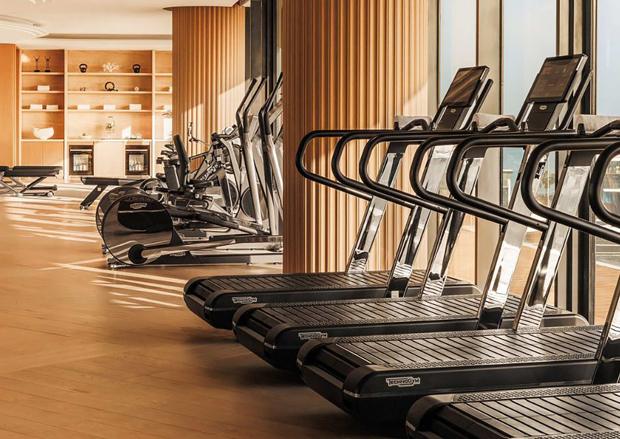 The fitness centre with treadmills facing the windows