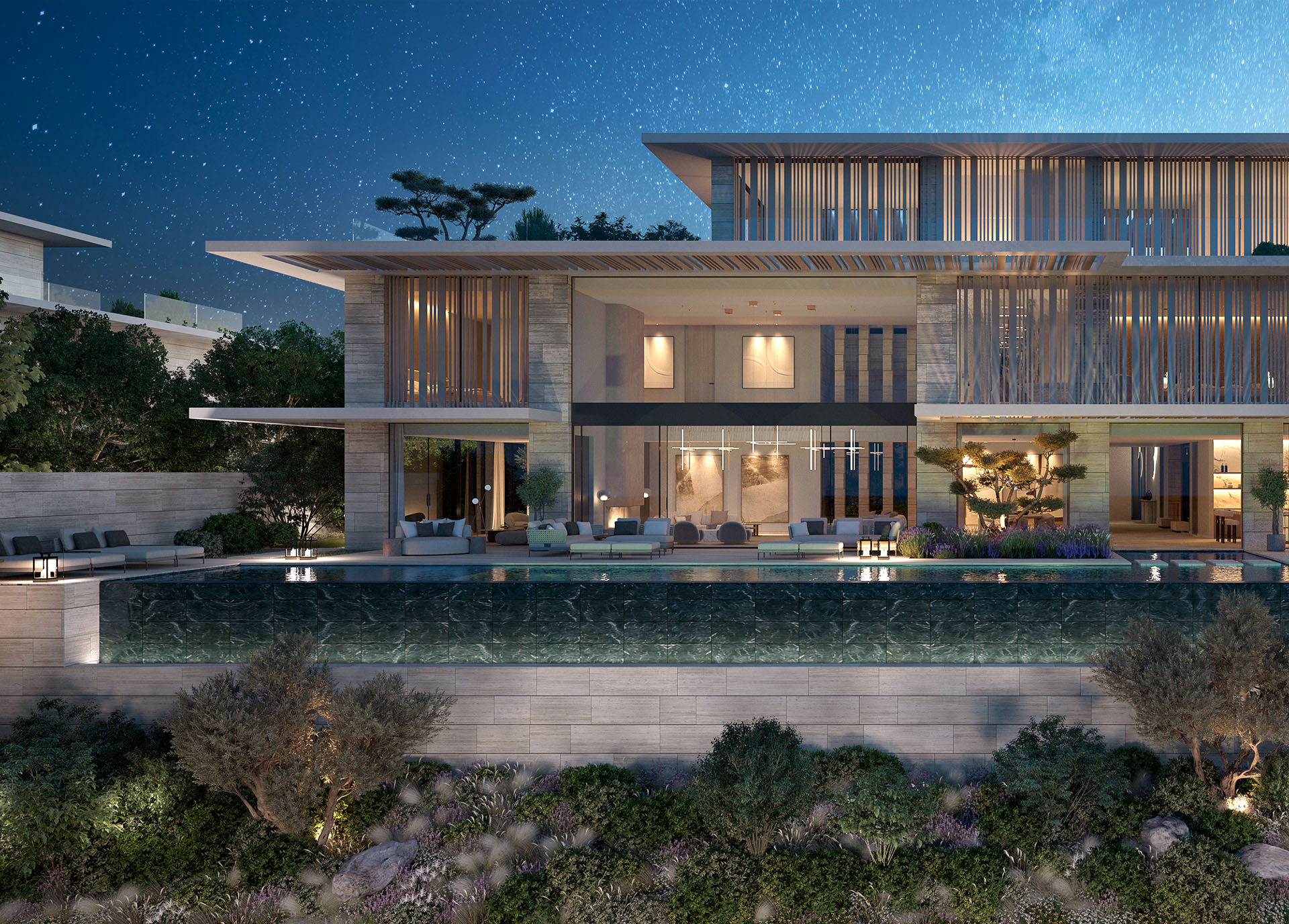 A Nawayef mansion at night, its infinity pool lit along the terrace and the hillside garden falling away below