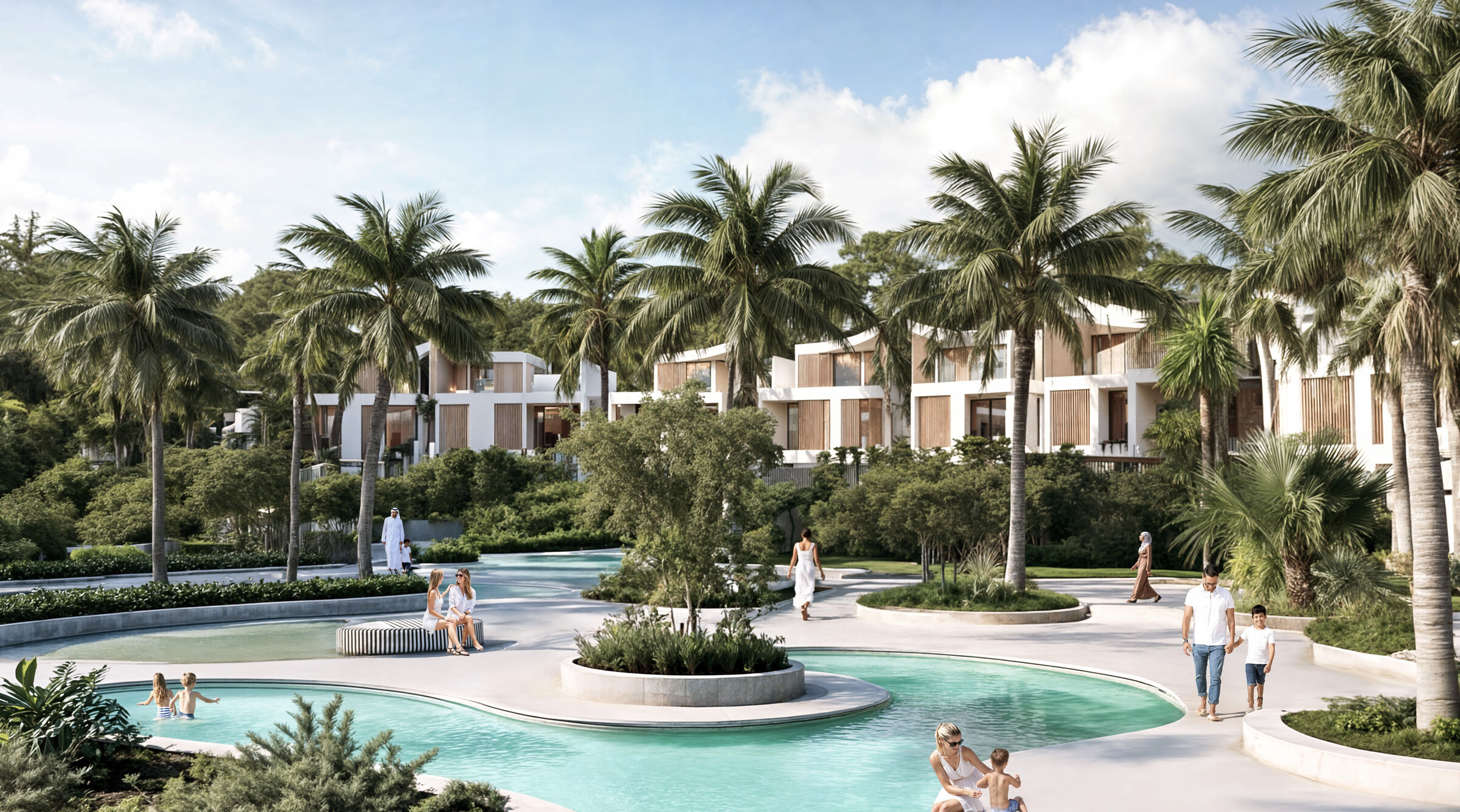A Lunaya cluster lagoon: families at the water's edge, with the villas behind the palms