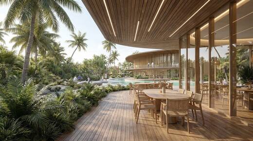 An open-sided restaurant beside the lagoon under a timber roof