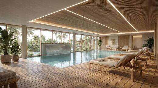 The indoor pool in the wellness centre, opening to the gardens