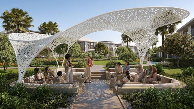 The outdoor majlis pavilion under a perforated white canopy